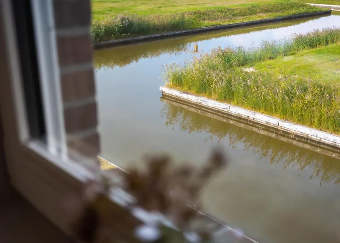 Dom wakacyjny Kuesten Haus Grachtenwinkel Direkte Wasserlage, 2 Terrassen, 106qm, Neubaugebiet Greetsiel